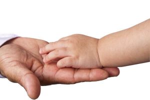 child's hand in parent's